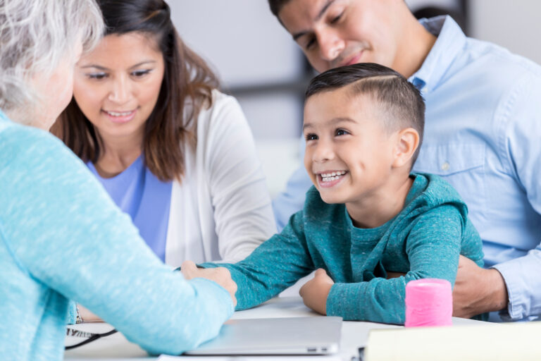 Nurse examines boy in community free clinic